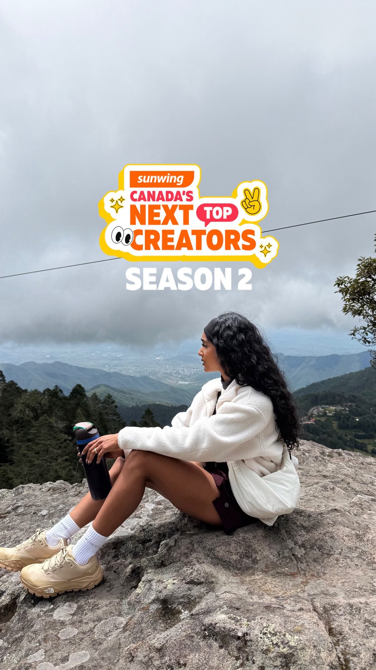 Creator at a mountain overlook during a brand campaign